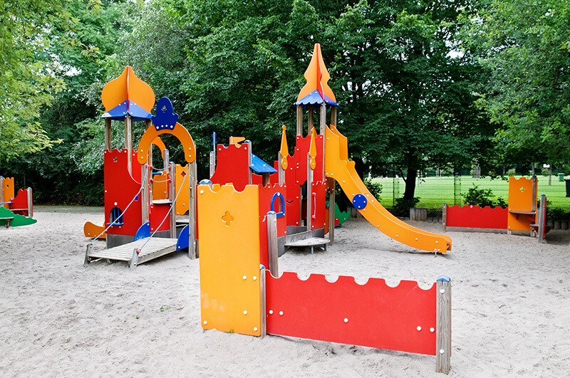A playground with a castle and a castle.