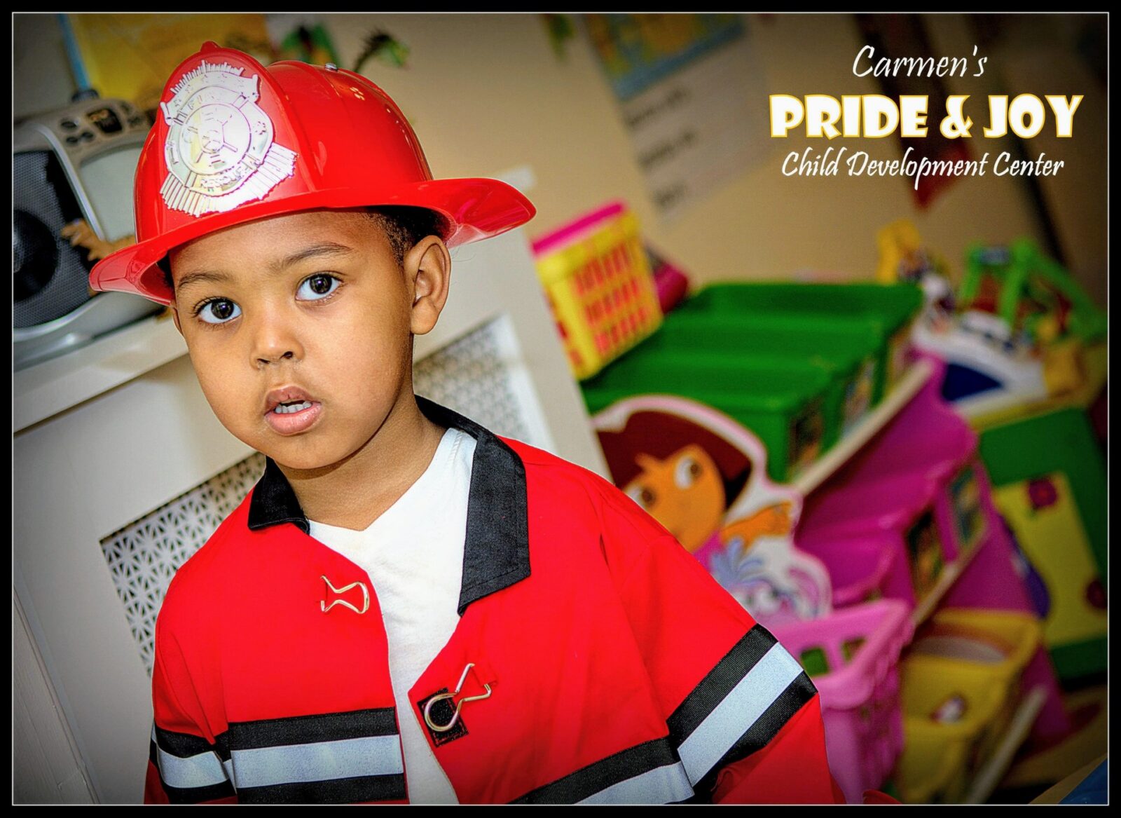 A young boy in a firefighter costume.